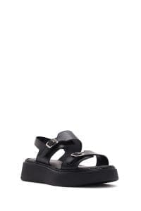 صندل زنانه مشکی چرم سگک‌دار تخت ضخیم راحتی دری مد