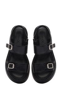 صندل زنانه مشکی چرم سگک‌دار تخت ضخیم راحتی دری مد