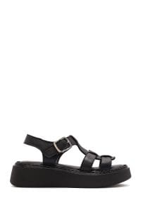 صندل زنانه مشکی چرم سگک‌دار تخت ضخیم راحتی دری مد