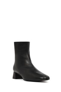 بوت زنانه چرم مشکی کوتاه زیپ‌دار پاشنه‌بلند ضخیم دری مد