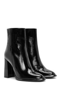 بوت زنانه چرم ورنی مشکی پاشنه‌بلند ضخیم بلند زیپ‌دار دری مد