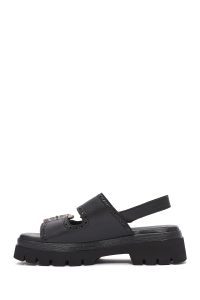 صندل زنانه مشکی چرم سگک‌دار تخت ضخیم بندی دری مد