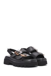 صندل زنانه مشکی چرم سگک‌دار تخت ضخیم بندی دری مد