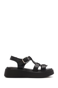 صندل زنانه مشکی چرم سگک‌دار تخت ضخیم راحتی دری مد