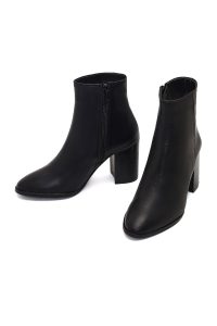 بوت چرمی زنانه مشکی زیپ‌دار پاشنه ضخیم دری مد