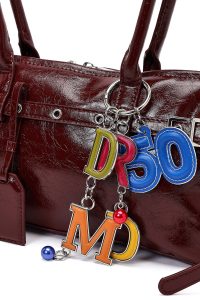 کیف زنانه زرشکی بنددار با اکسسوری دری مد